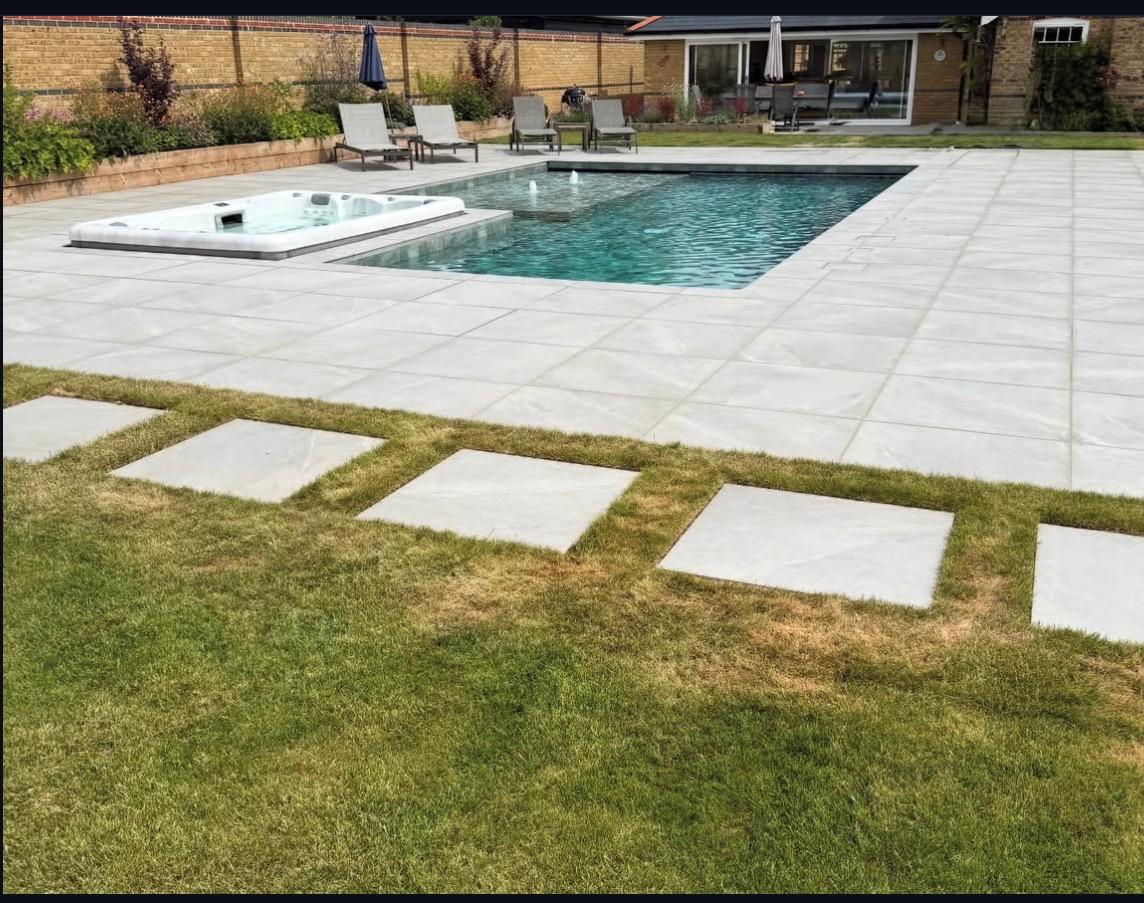 Luxury pool with stepping stones and hot tub
